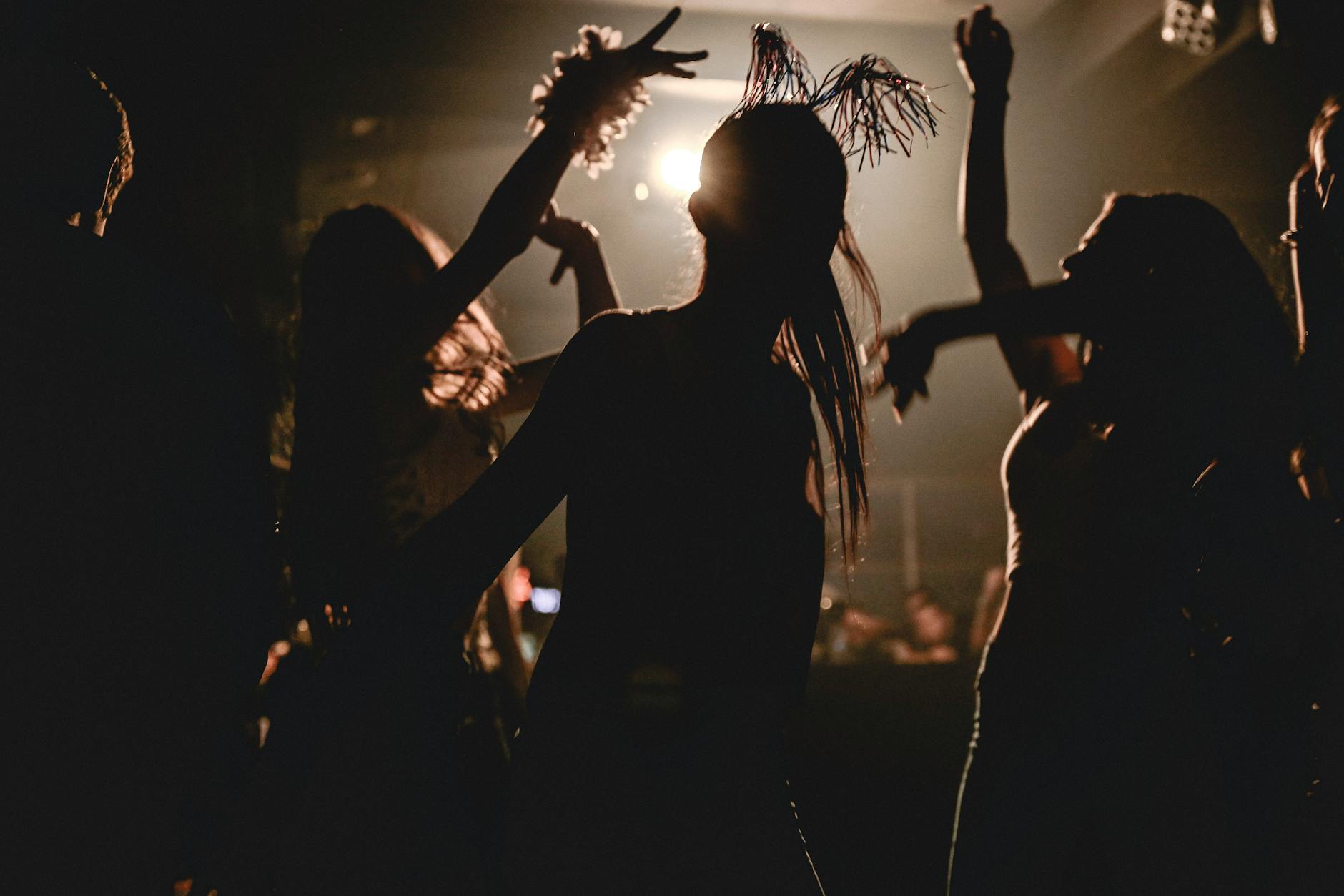 silhouette of women dancing