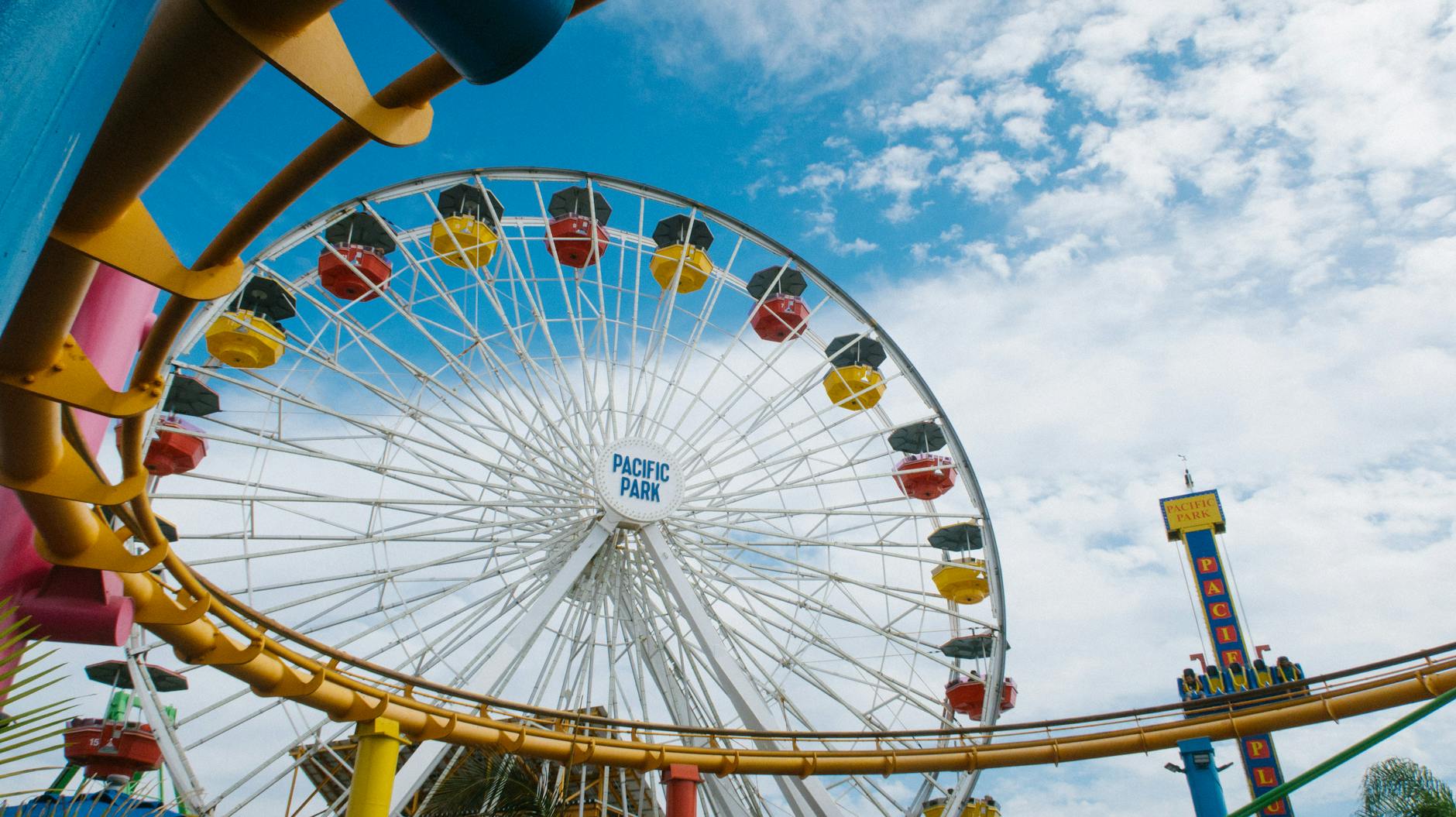 a roller coaster and ferris wheel