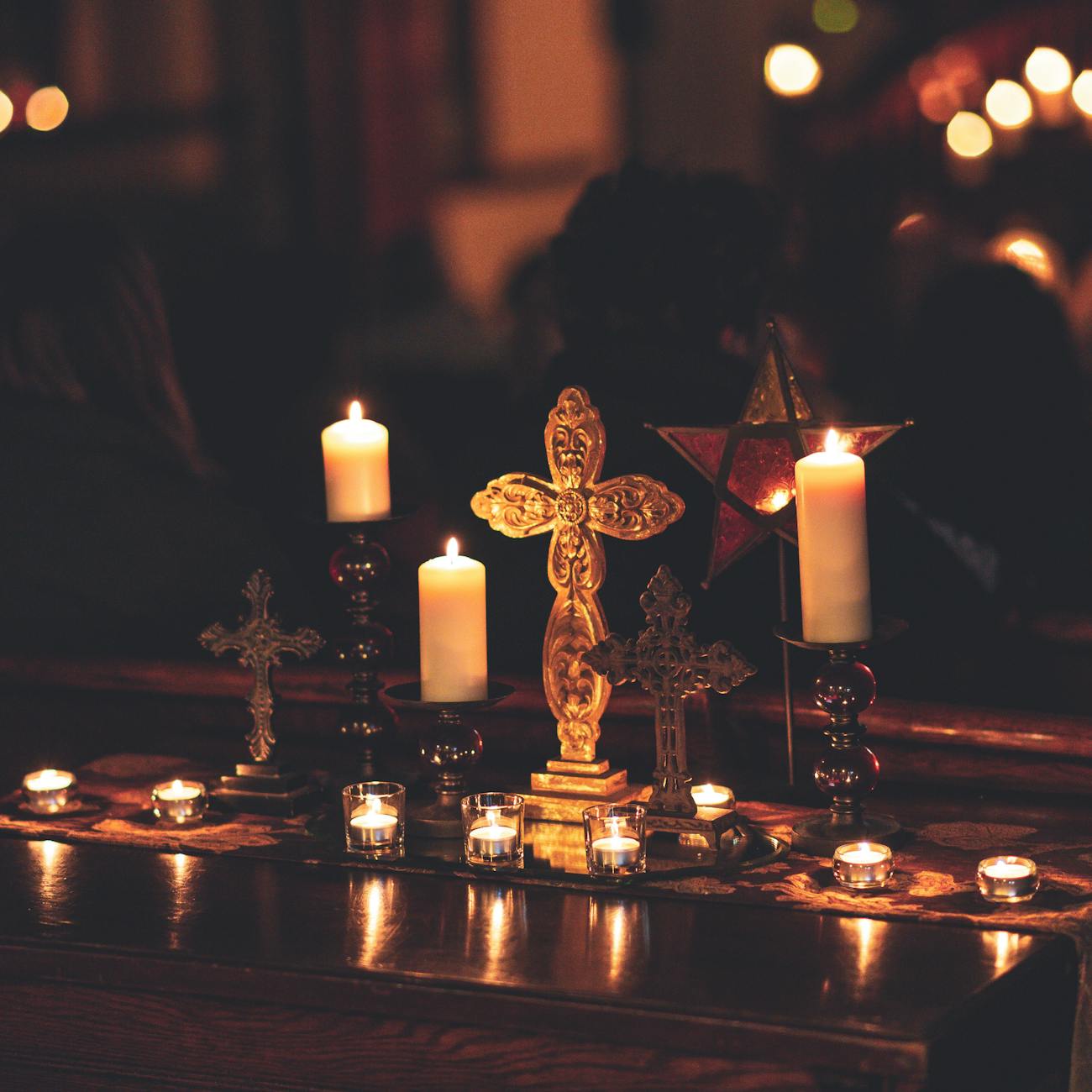 selective focus photography of lighted candles on table