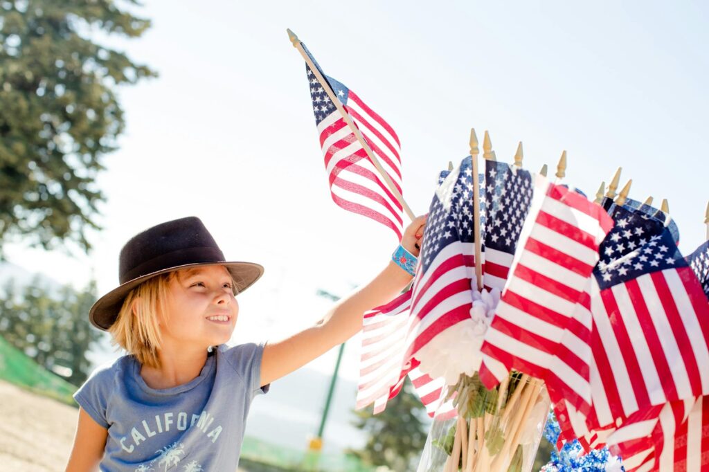 kid holding usa flag