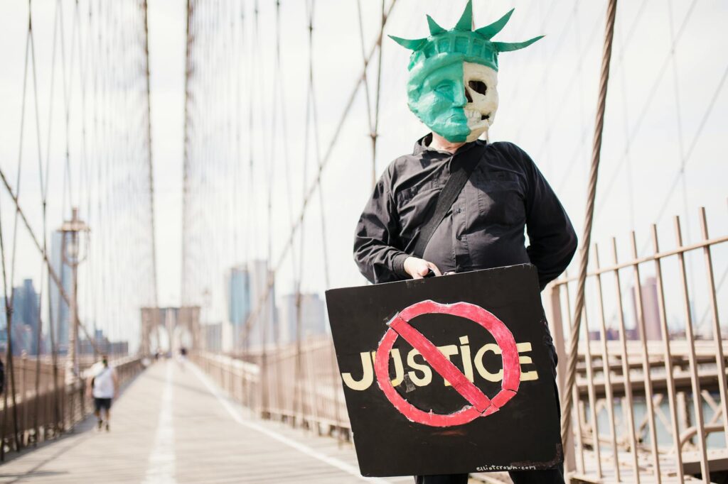 protester in a costume holding a sign