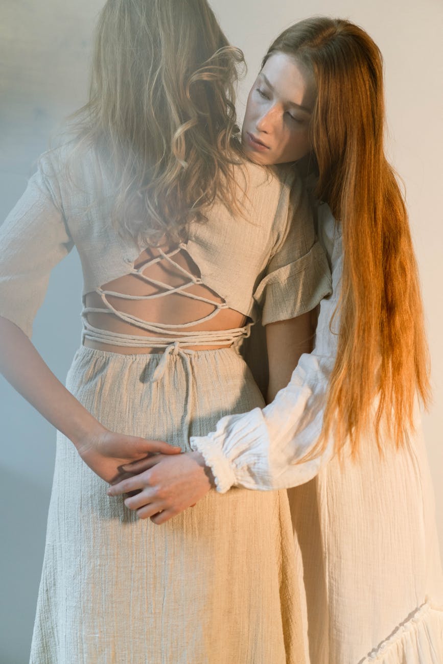 woman in white long sleeve shirt and blue denim jeans