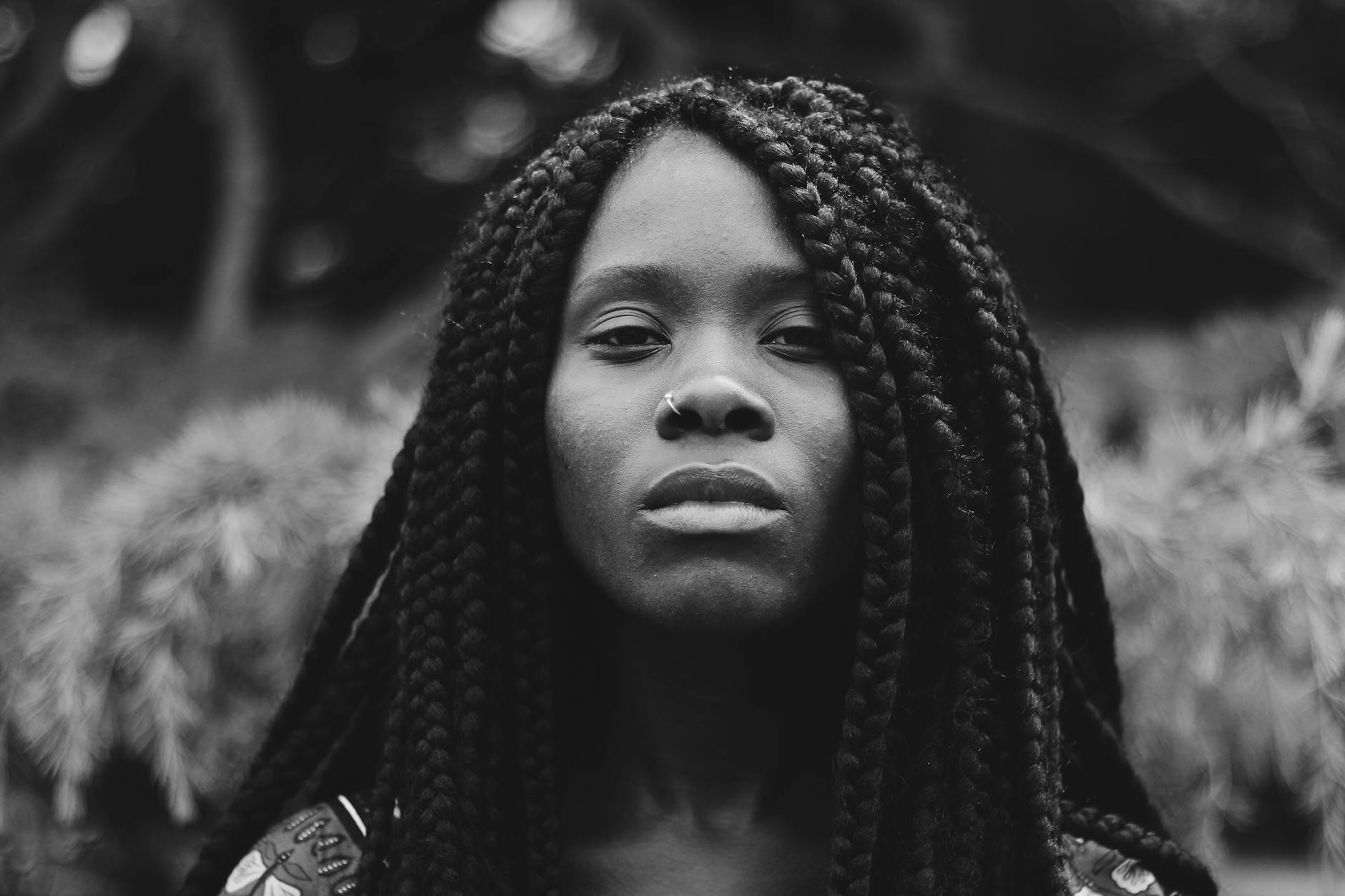 grayscale photo of braided hair woman