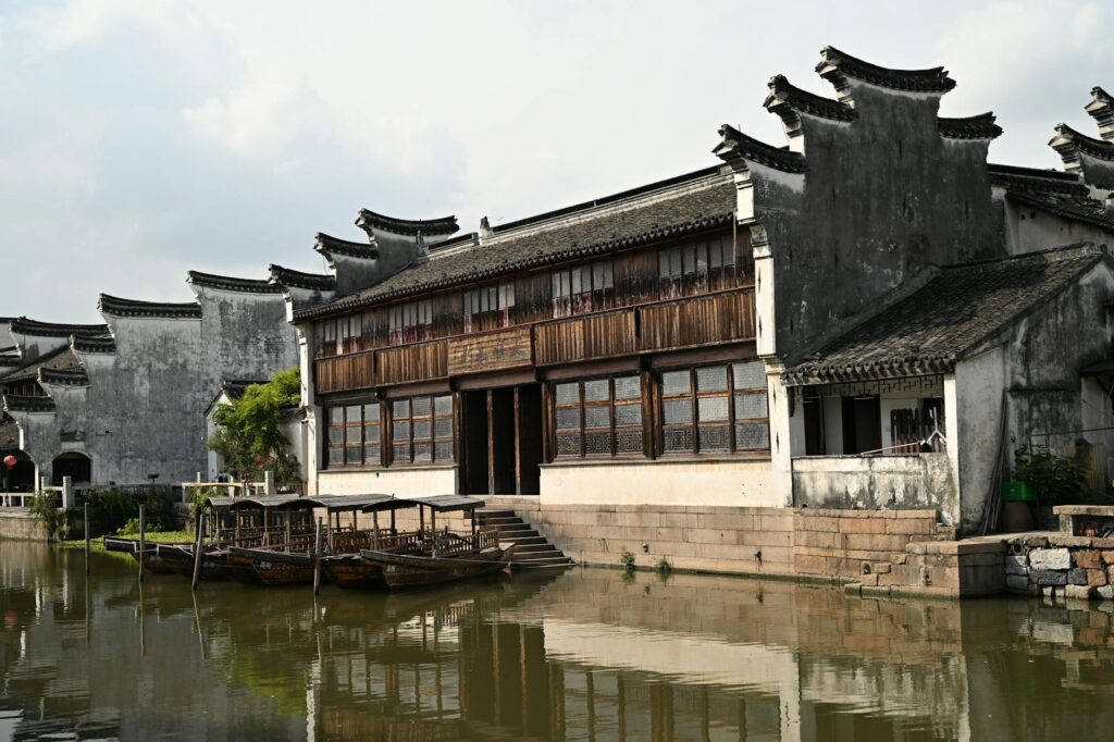 traditional chinese architecture by a serene canal