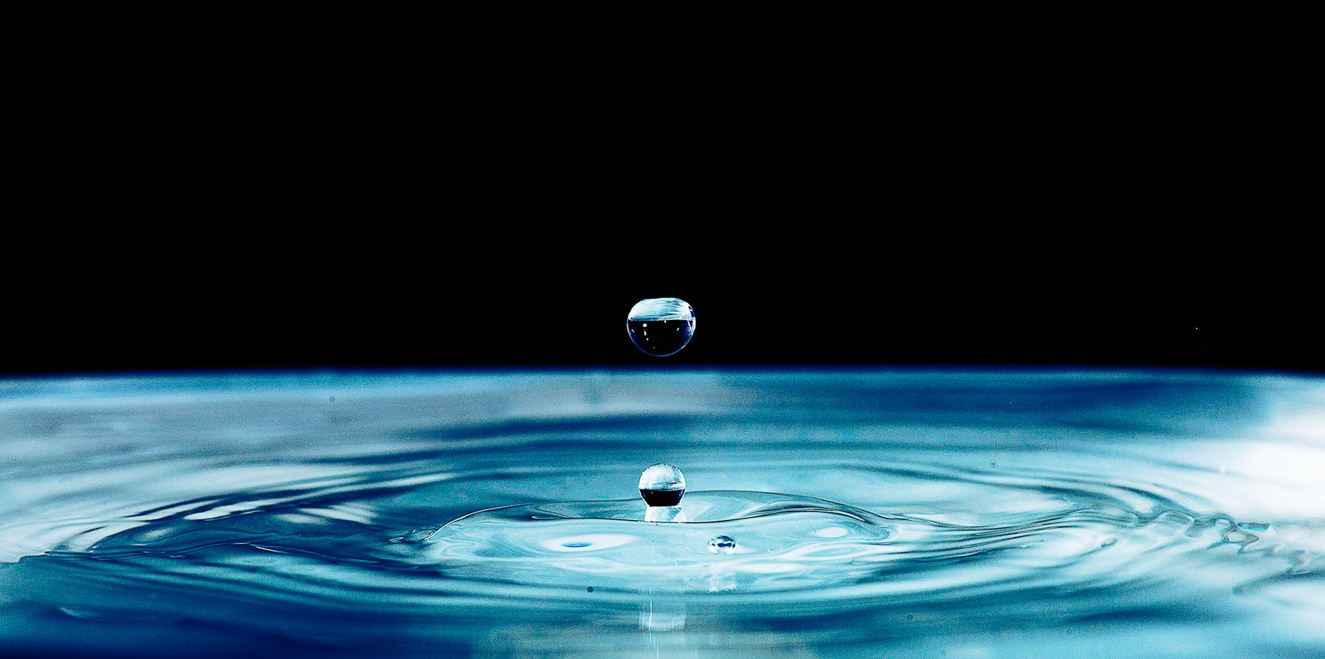 macro photography of water drop formation