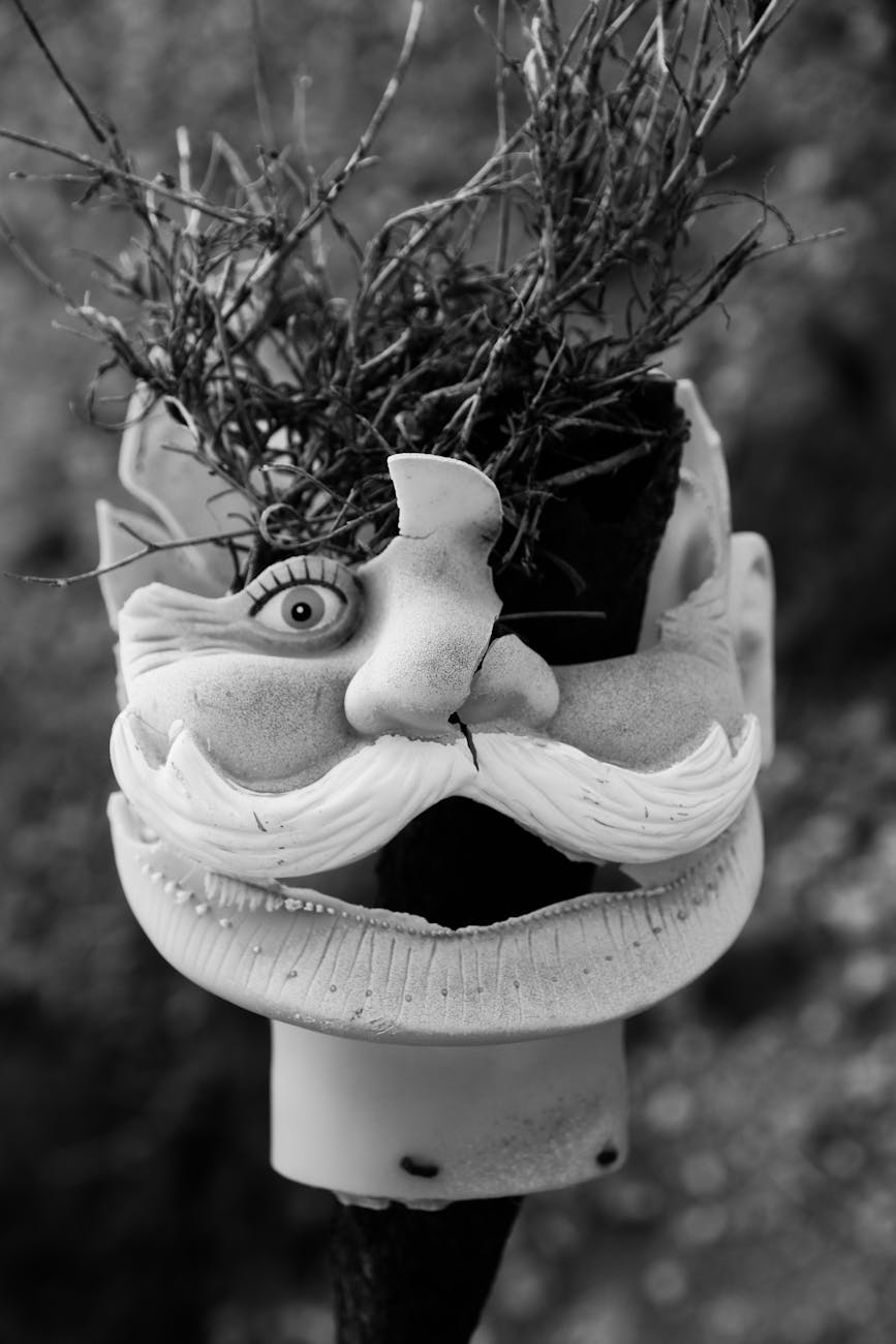 white bird ceramic figurine in grayscale photography