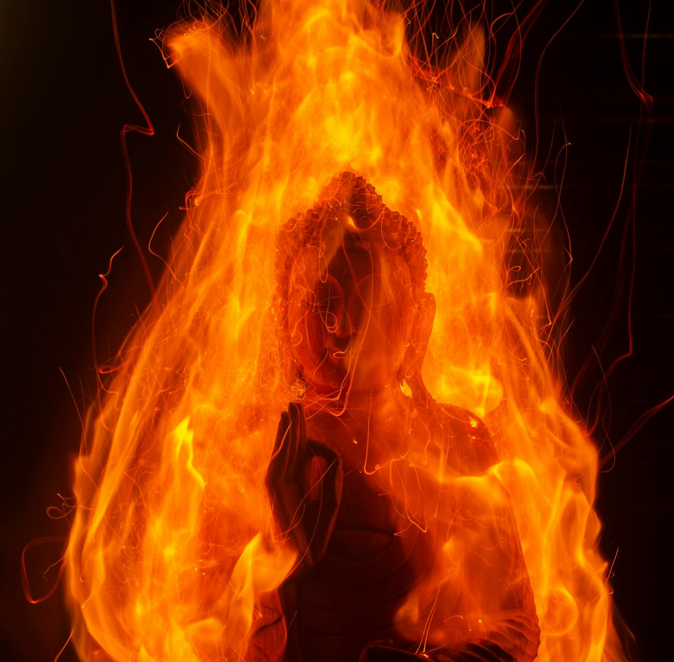 fiery buddha statue in vibrant flames