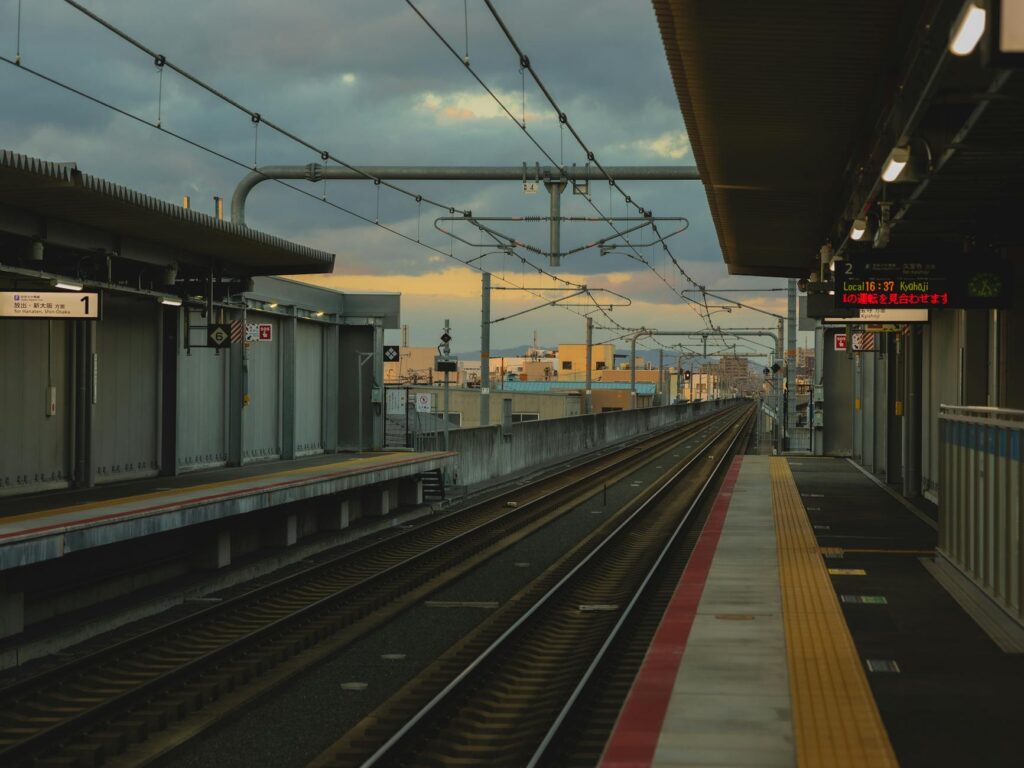 empty railway platform with rails