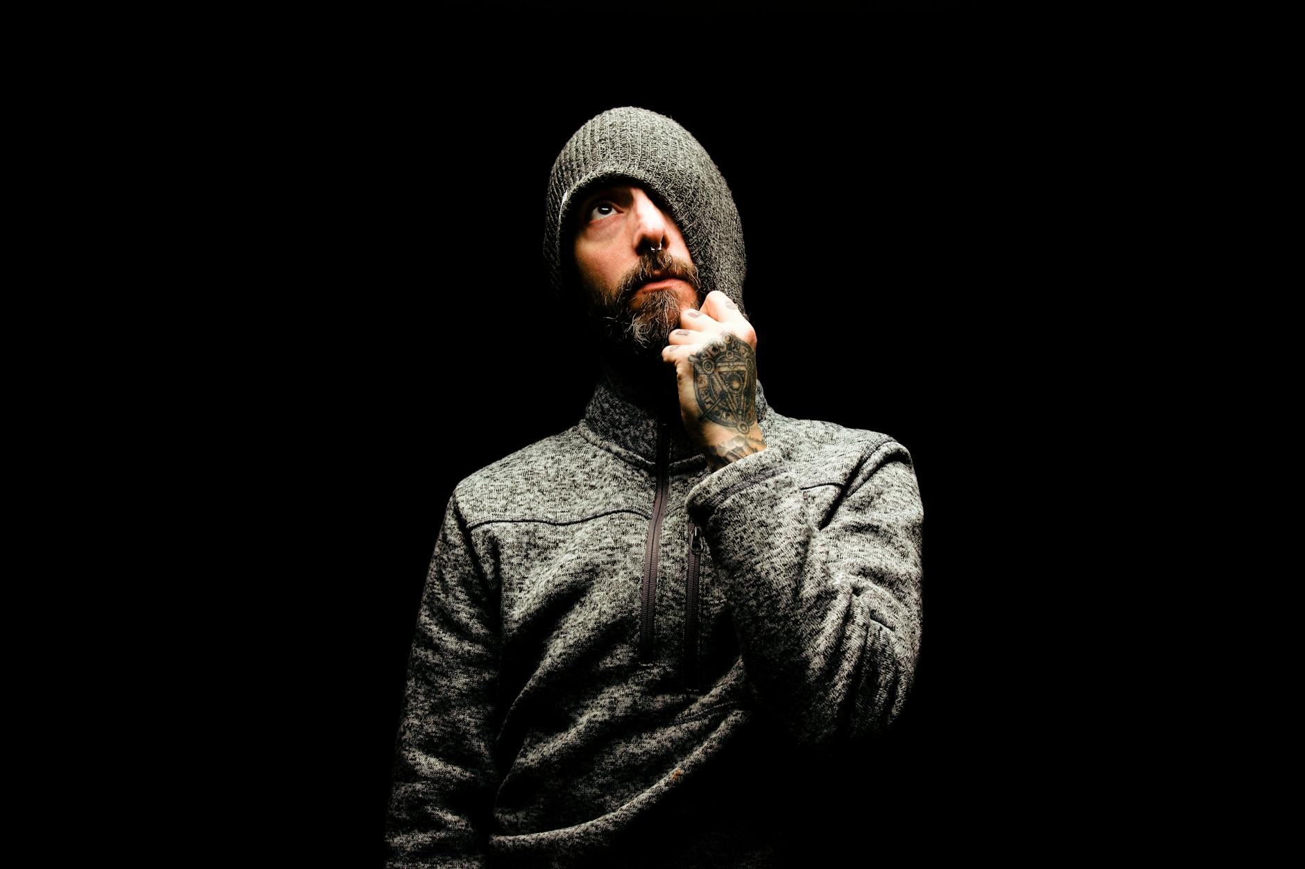 man in gray knit cap and gray sweater