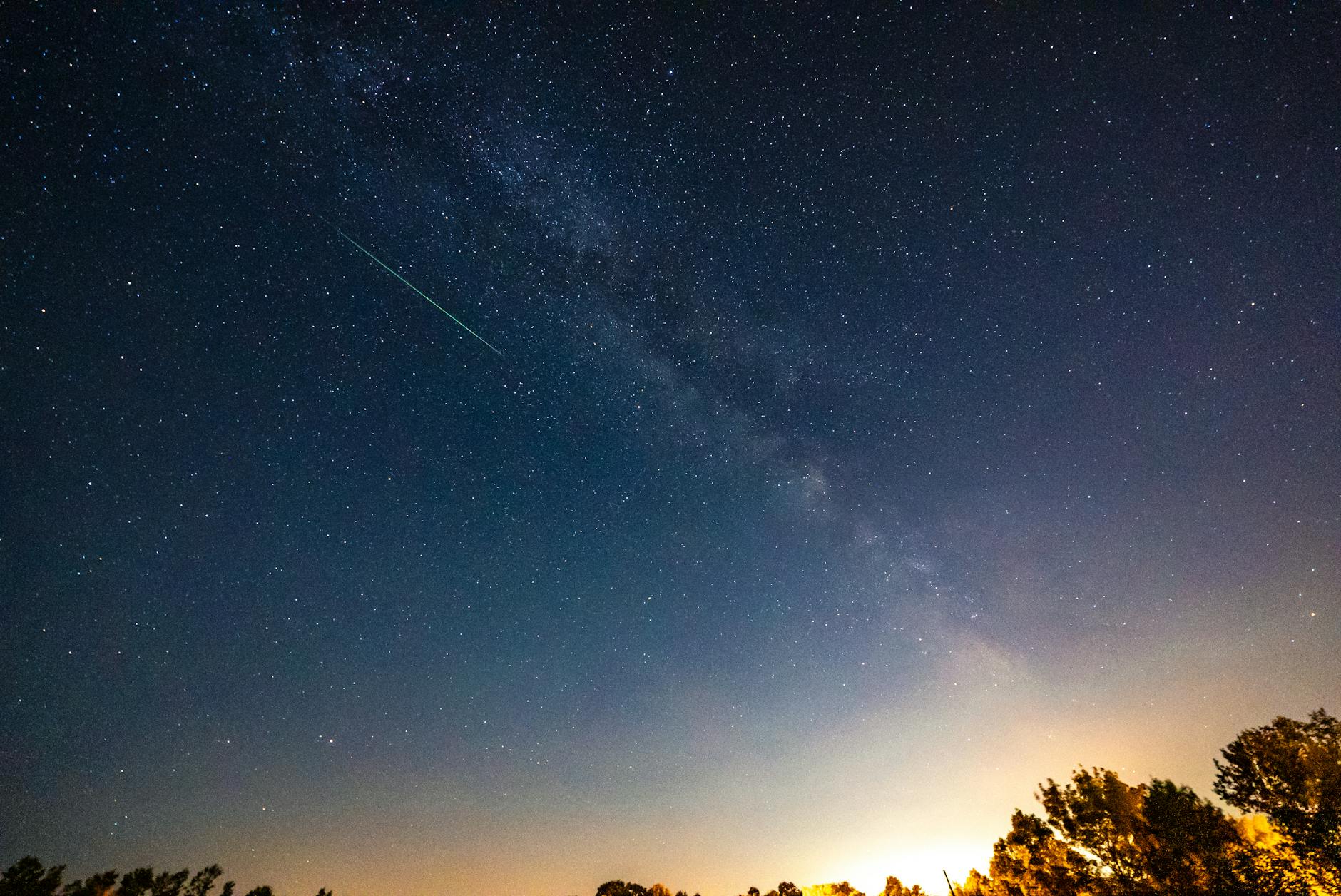 bolide shooting through a starry sky