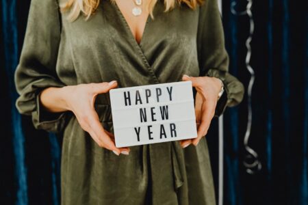 a woman holding a letter board