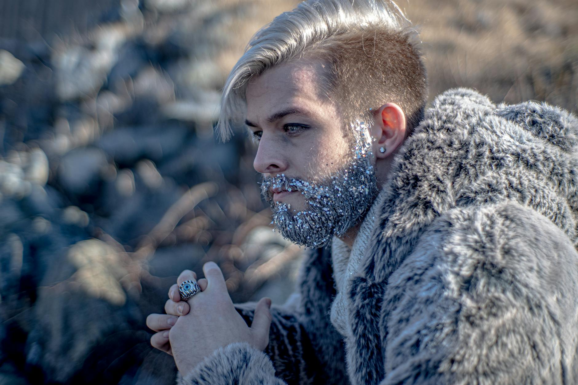 close up photo of a man with glitters on his beard