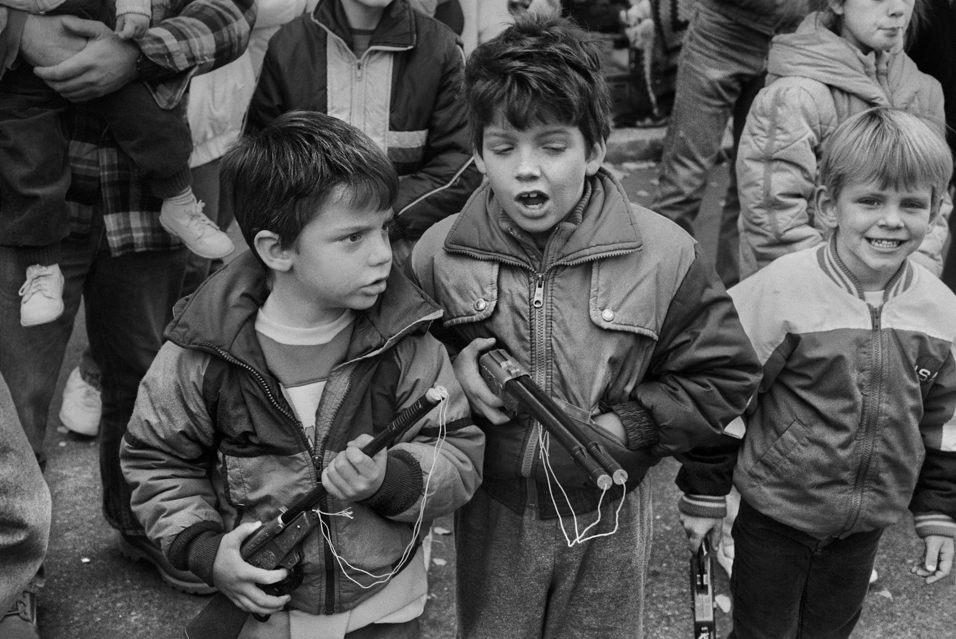 grayscale photo of kids on the street