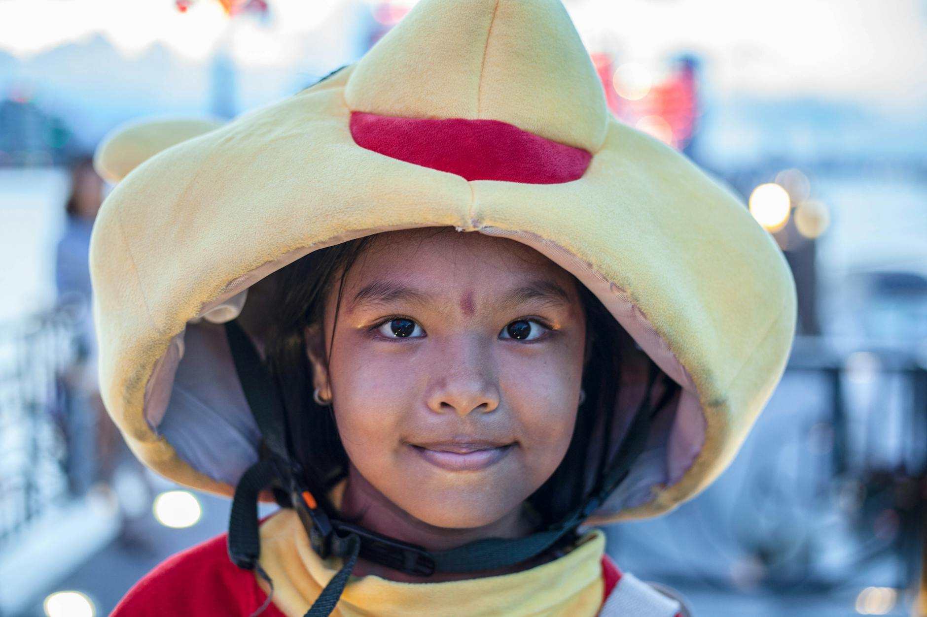 close up photo of cute girl in a yellow costume
