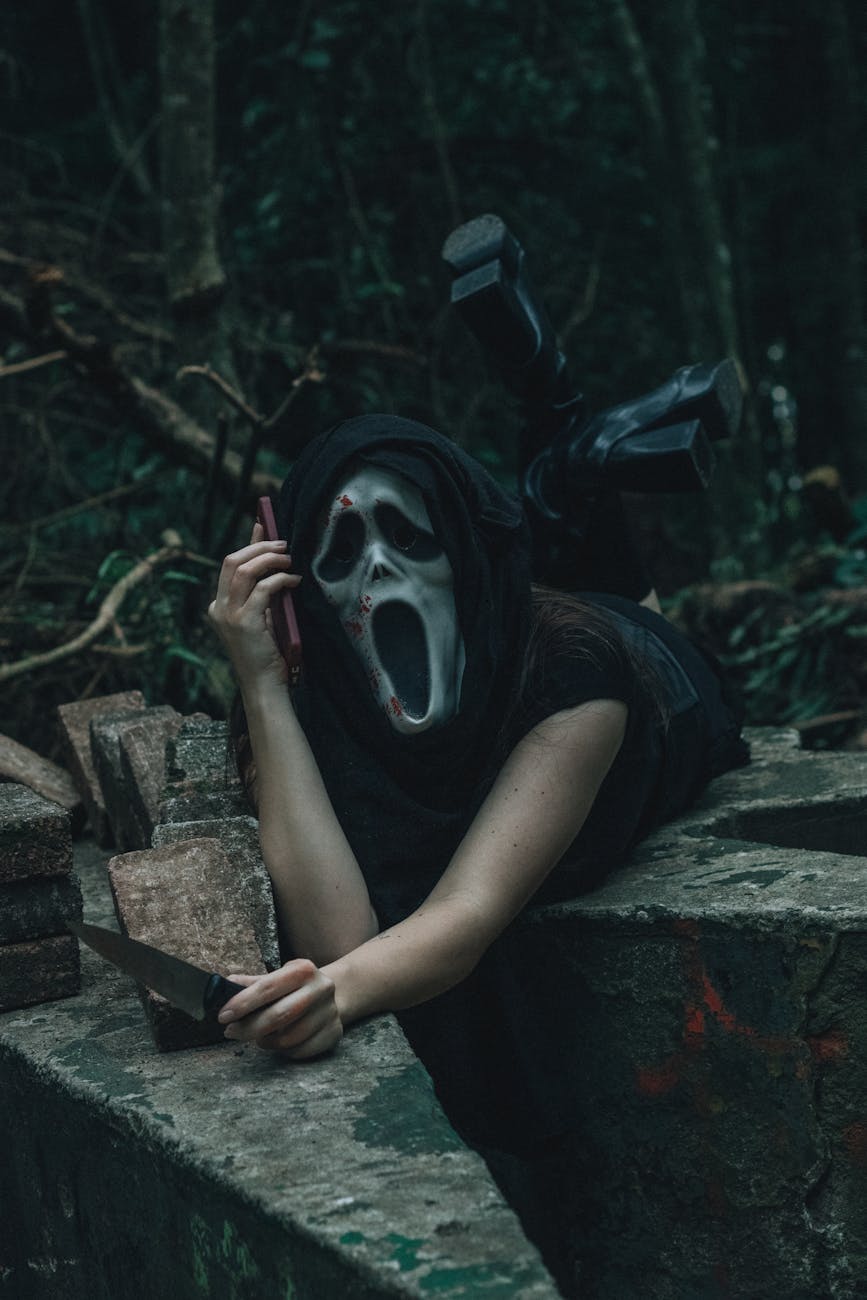 mysterious figure in dark forest with mask and props