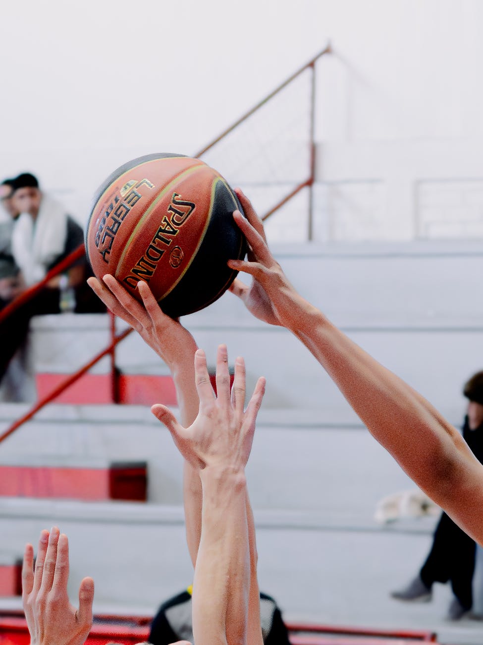 basketball players competing for rebound