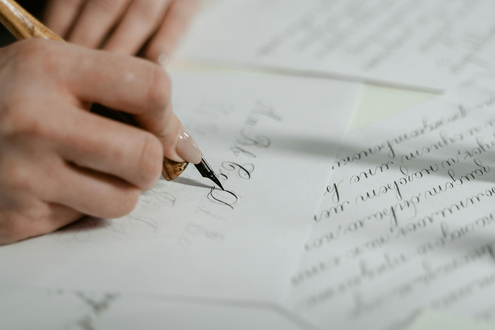 close up shot of a person writing on a paper
