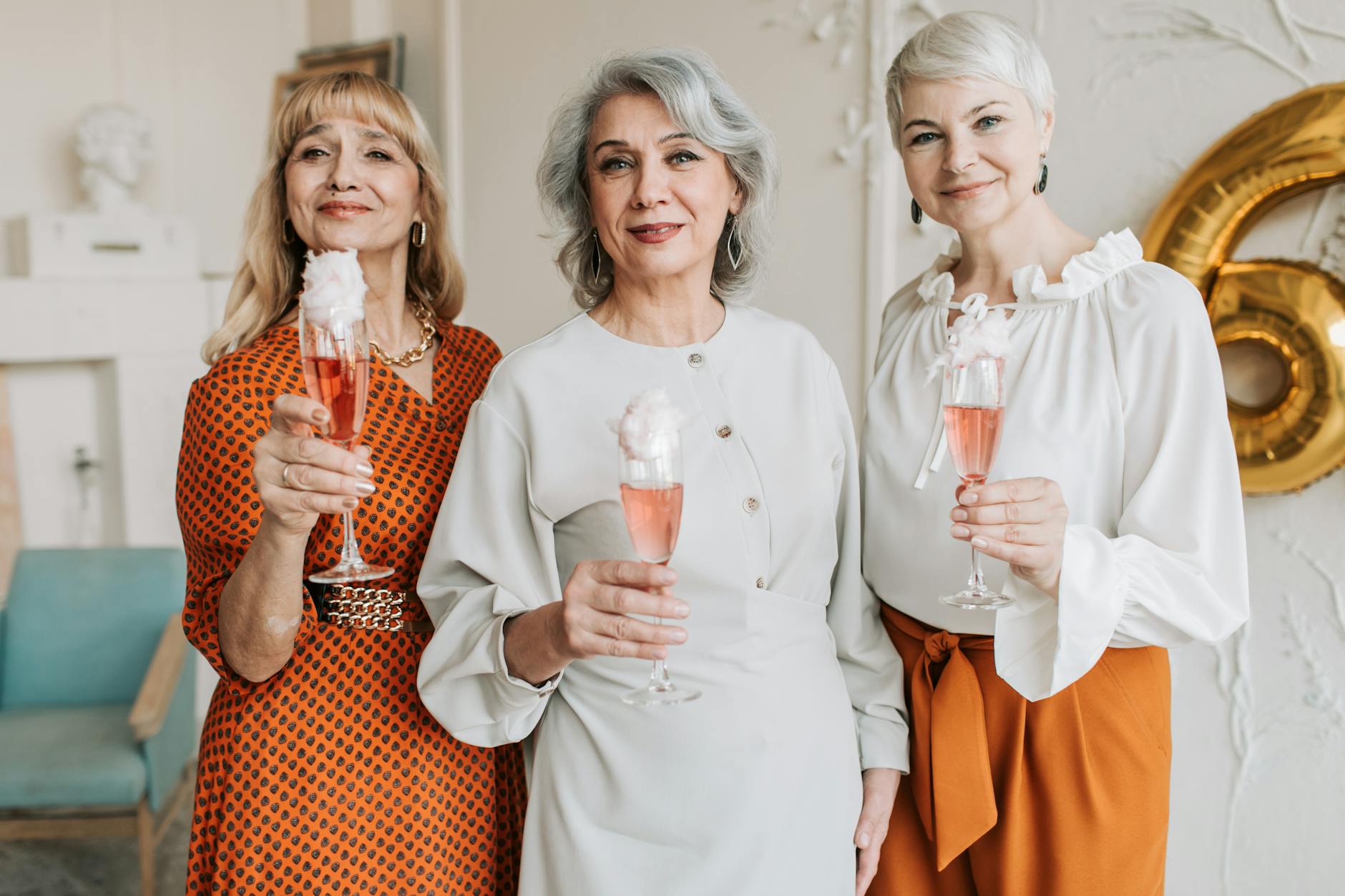 group of women holding champagne glass
