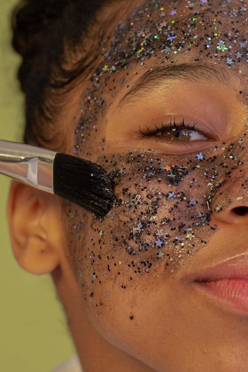 anonymous content black woman applying facial mask on face