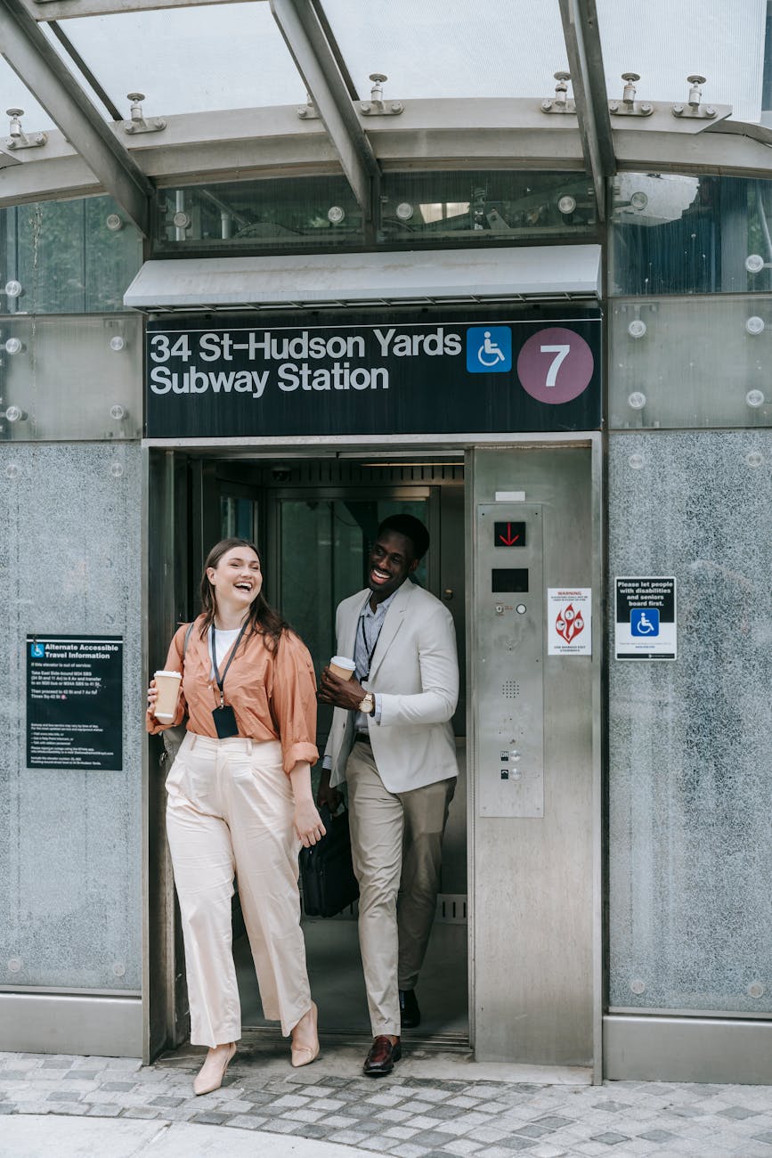 man and woman going out of elevator