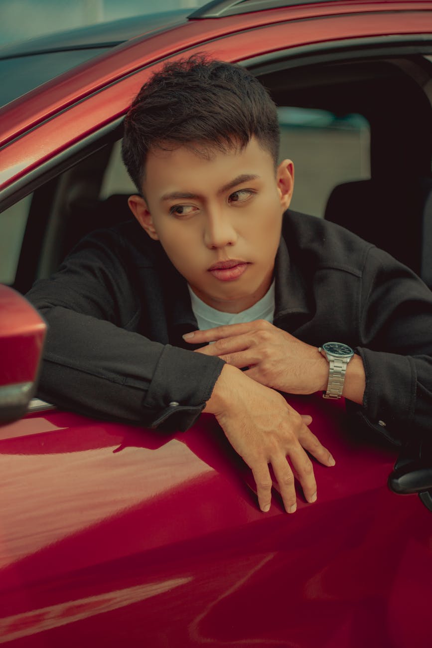 man sitting in car