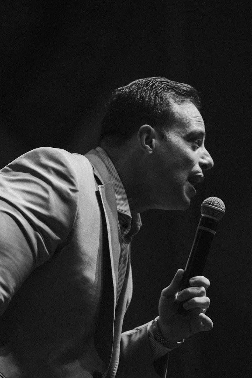 man speaking into a microphone