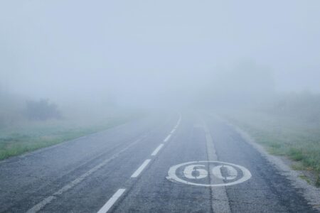 thick fog covering the mountain road