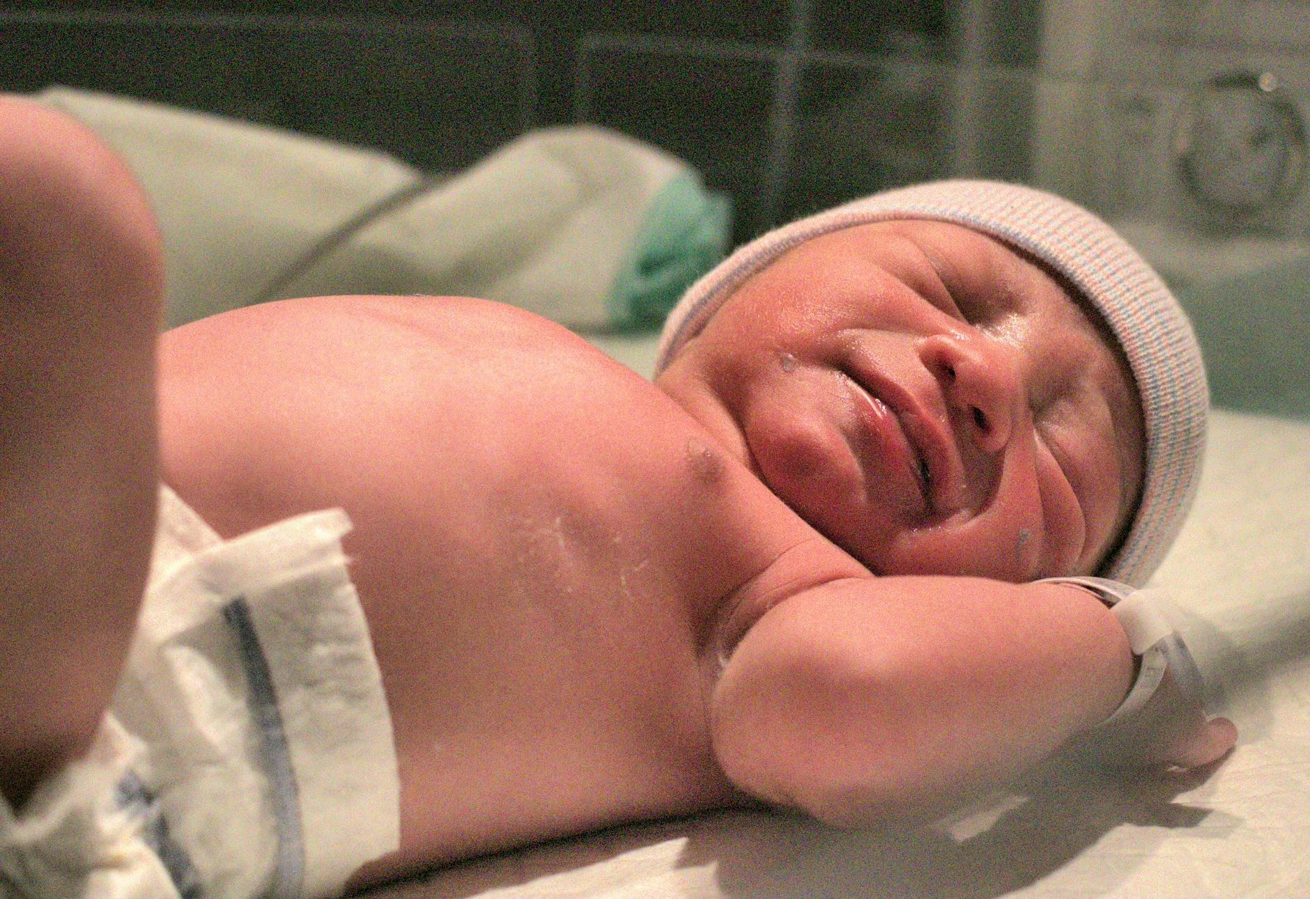 newborn baby in hospital blanket