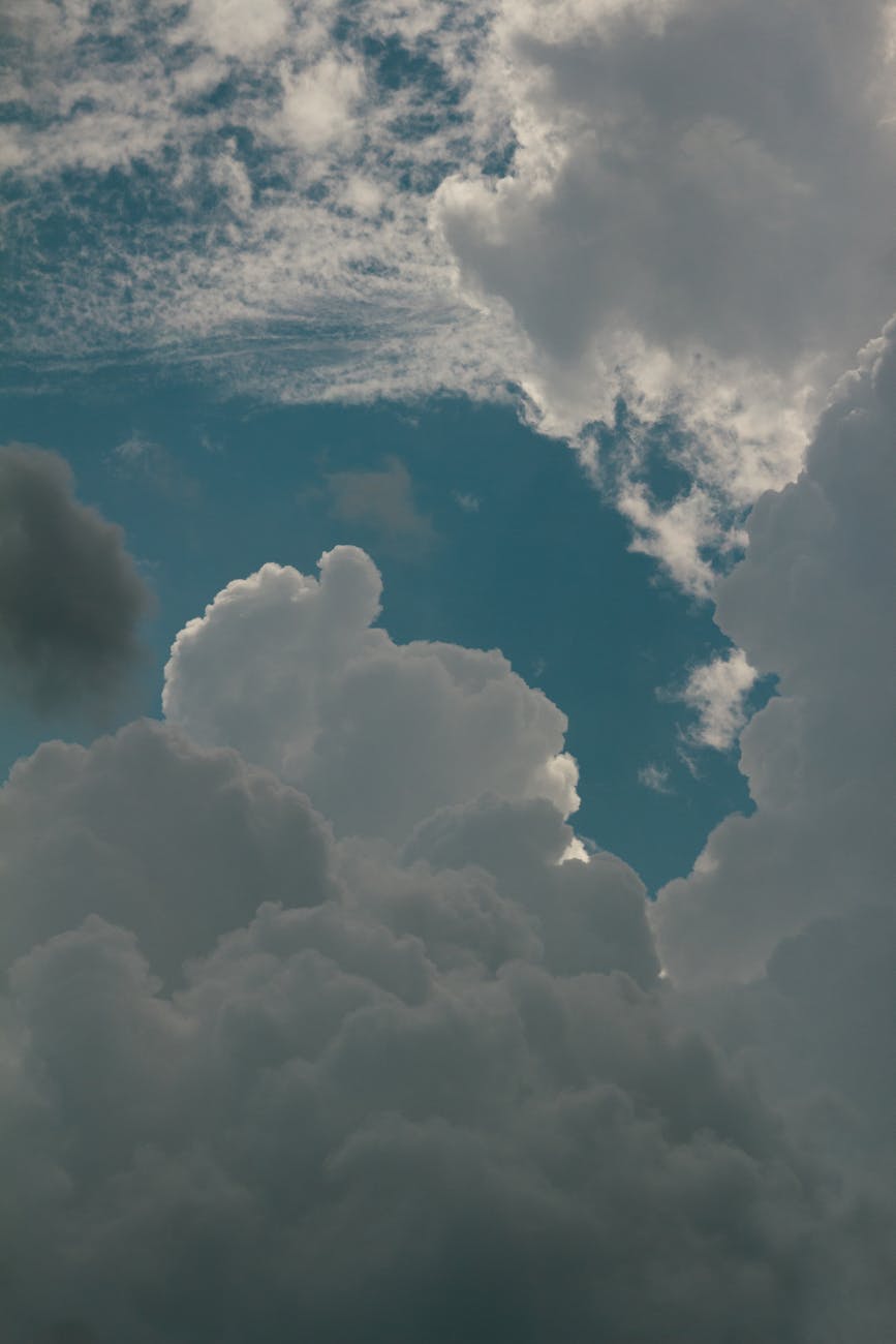 view of white clouds against blue sky