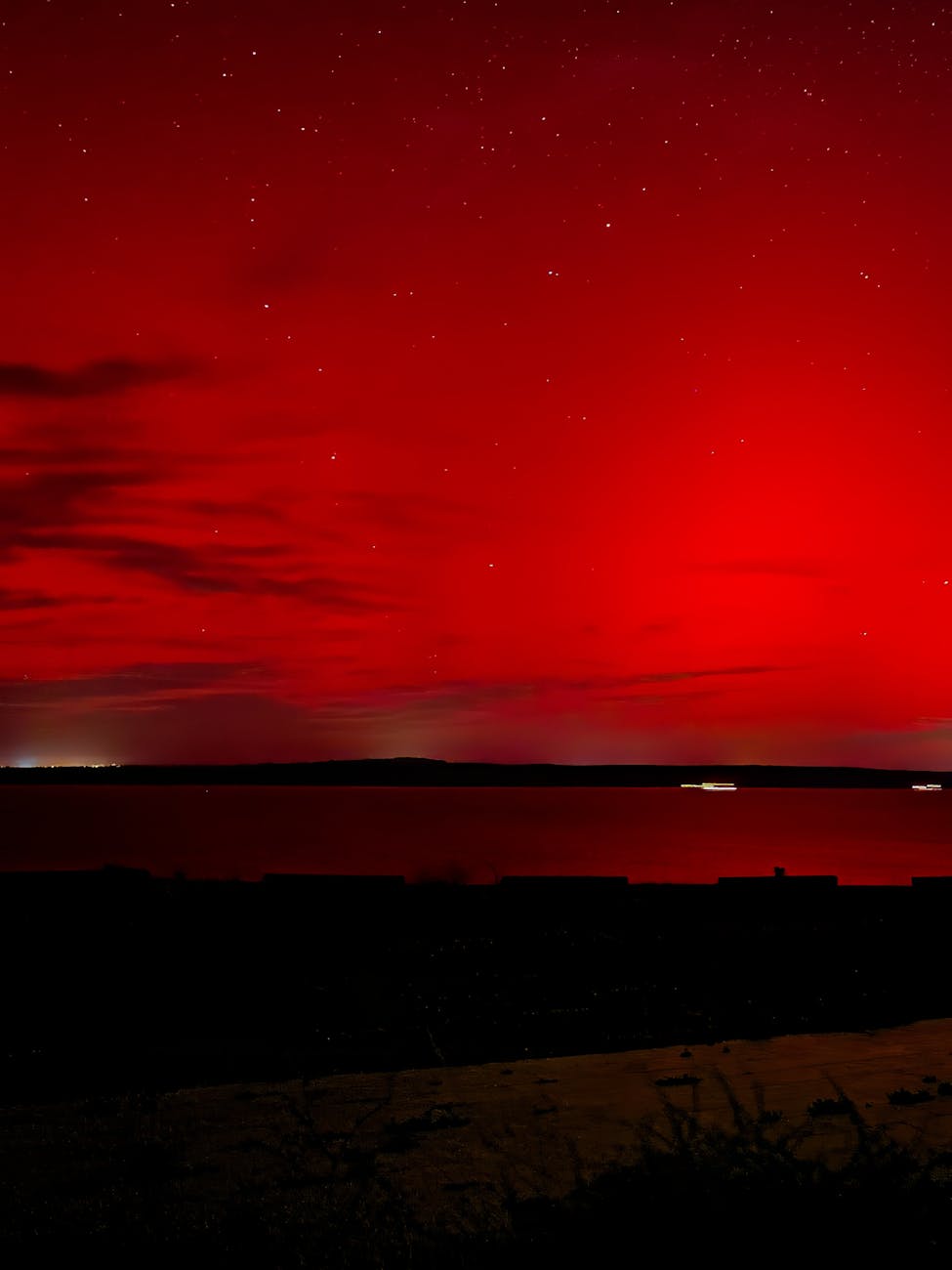 stunning red night sky over waterfront