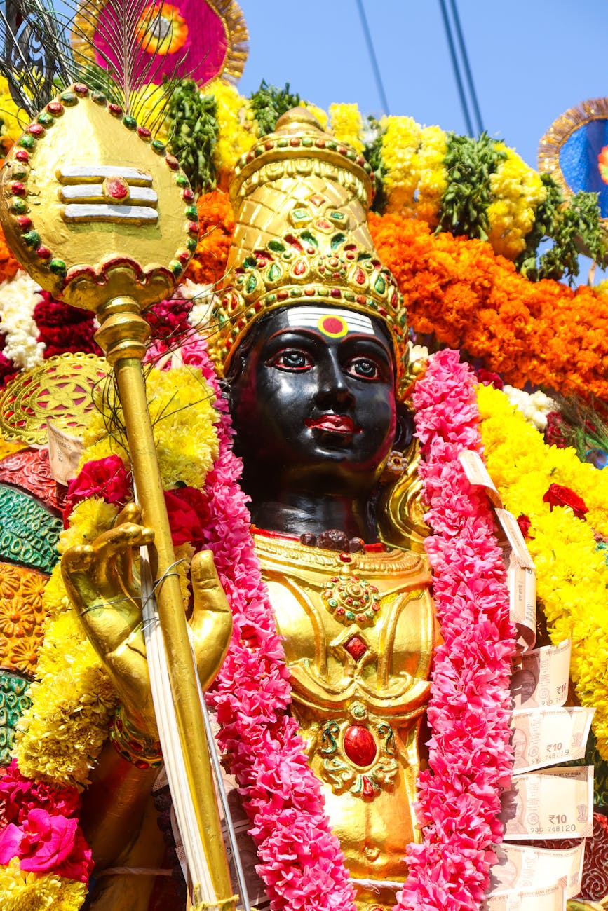 vibrant hindu festival statue decorated with flowers