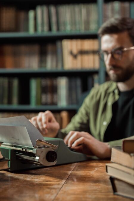 man using a typewriter