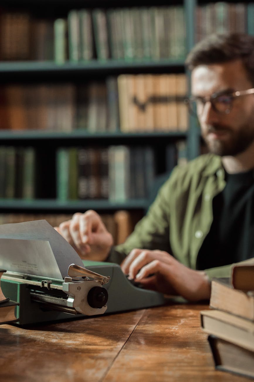 man using a typewriter