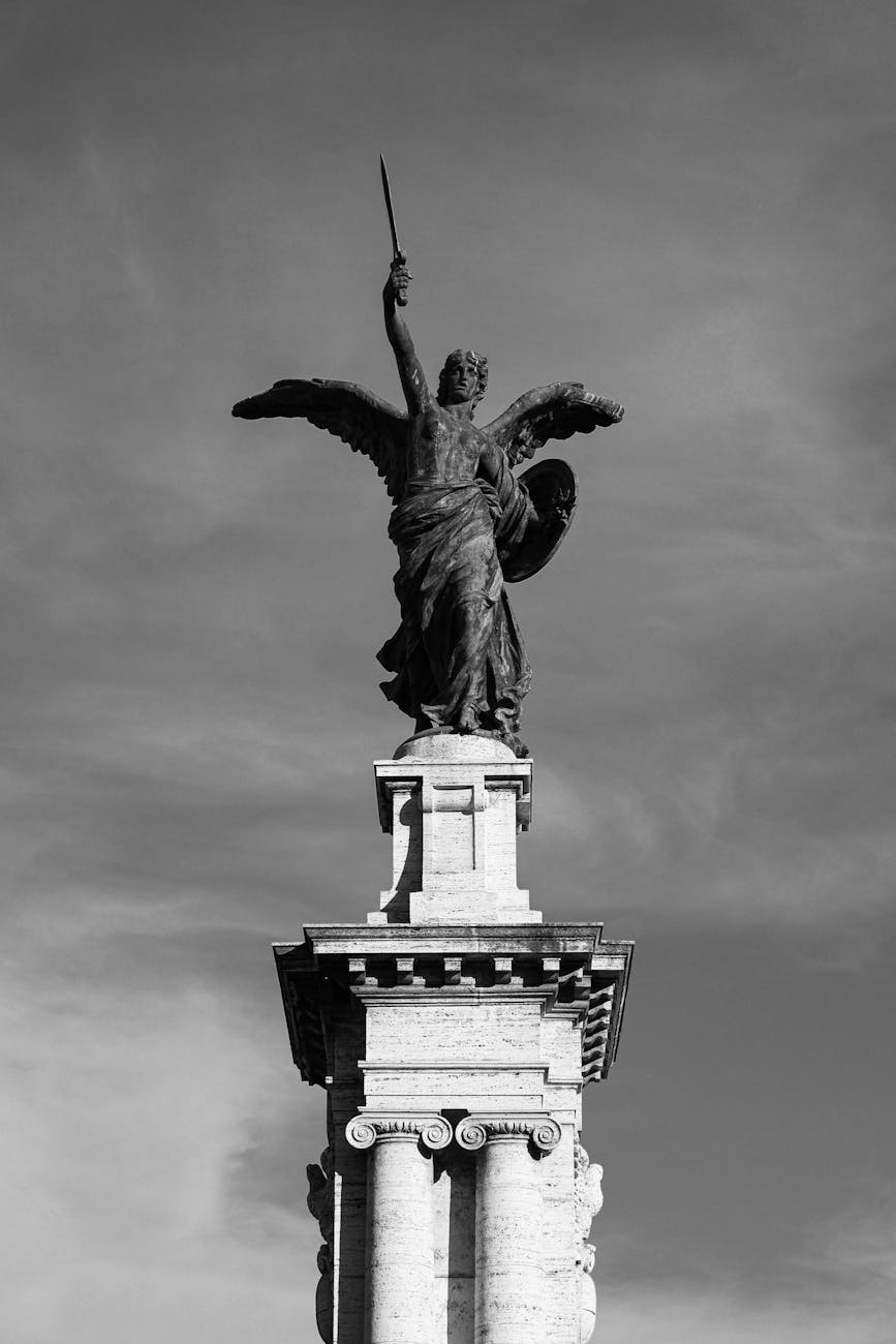 majestic angel statue in rome against dramatic sky