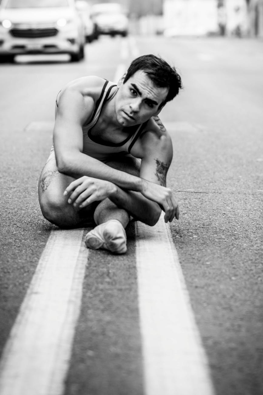 ballet dancer posed on urban street
