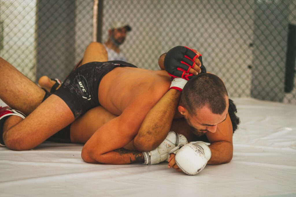 man in black shorts lying on white floor