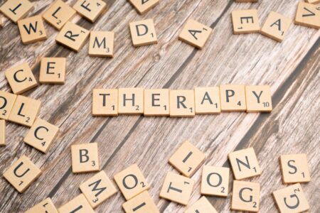 the word therapy spelled out in scrabble letters