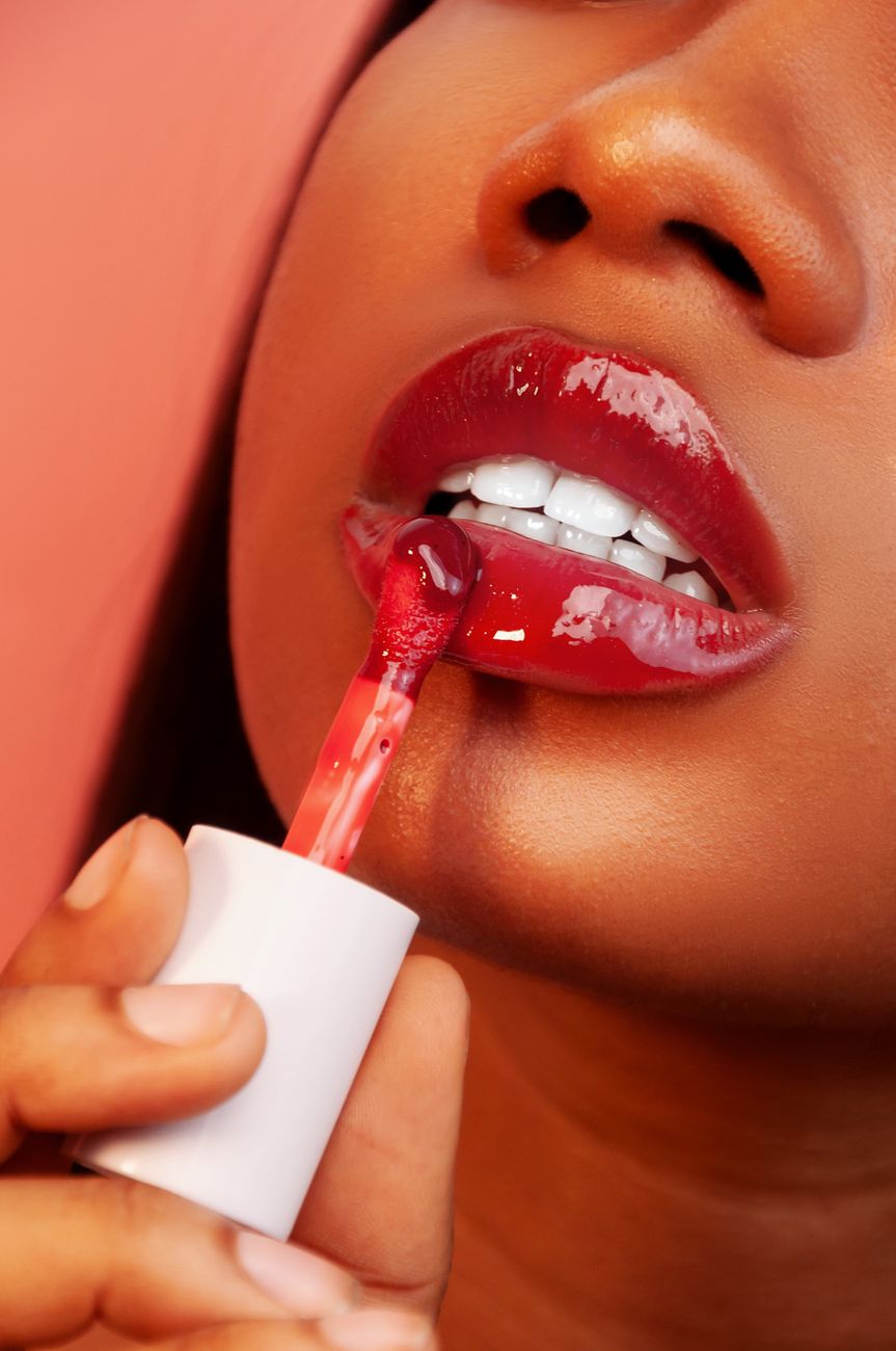 vibrant red lipstick application close up
