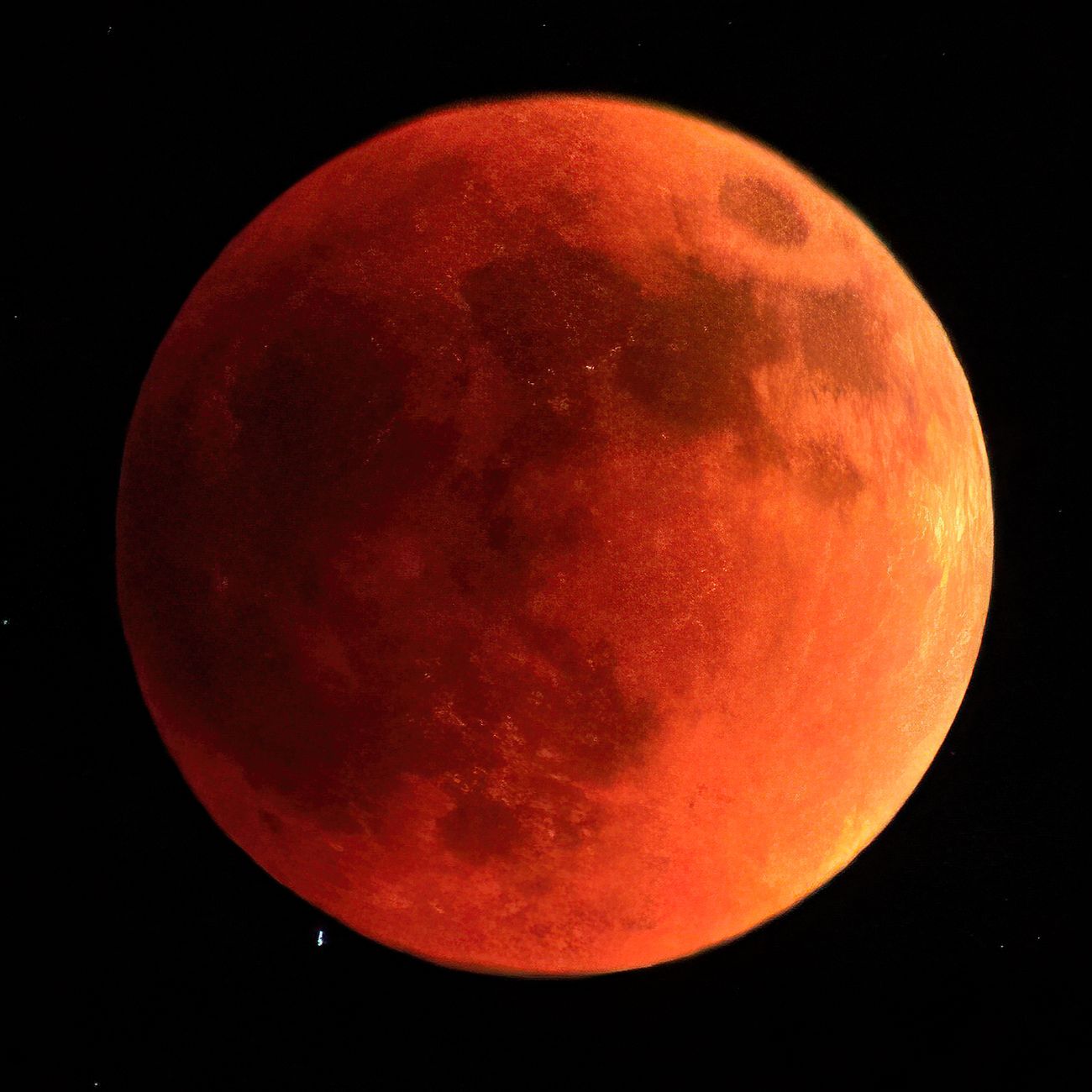 red moon in black background